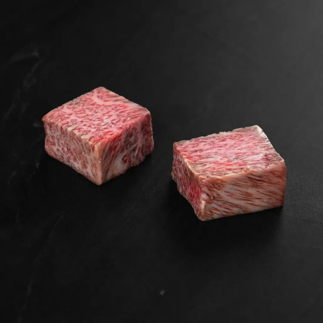 A5 Japanese Wagyu cubes on a counter tray